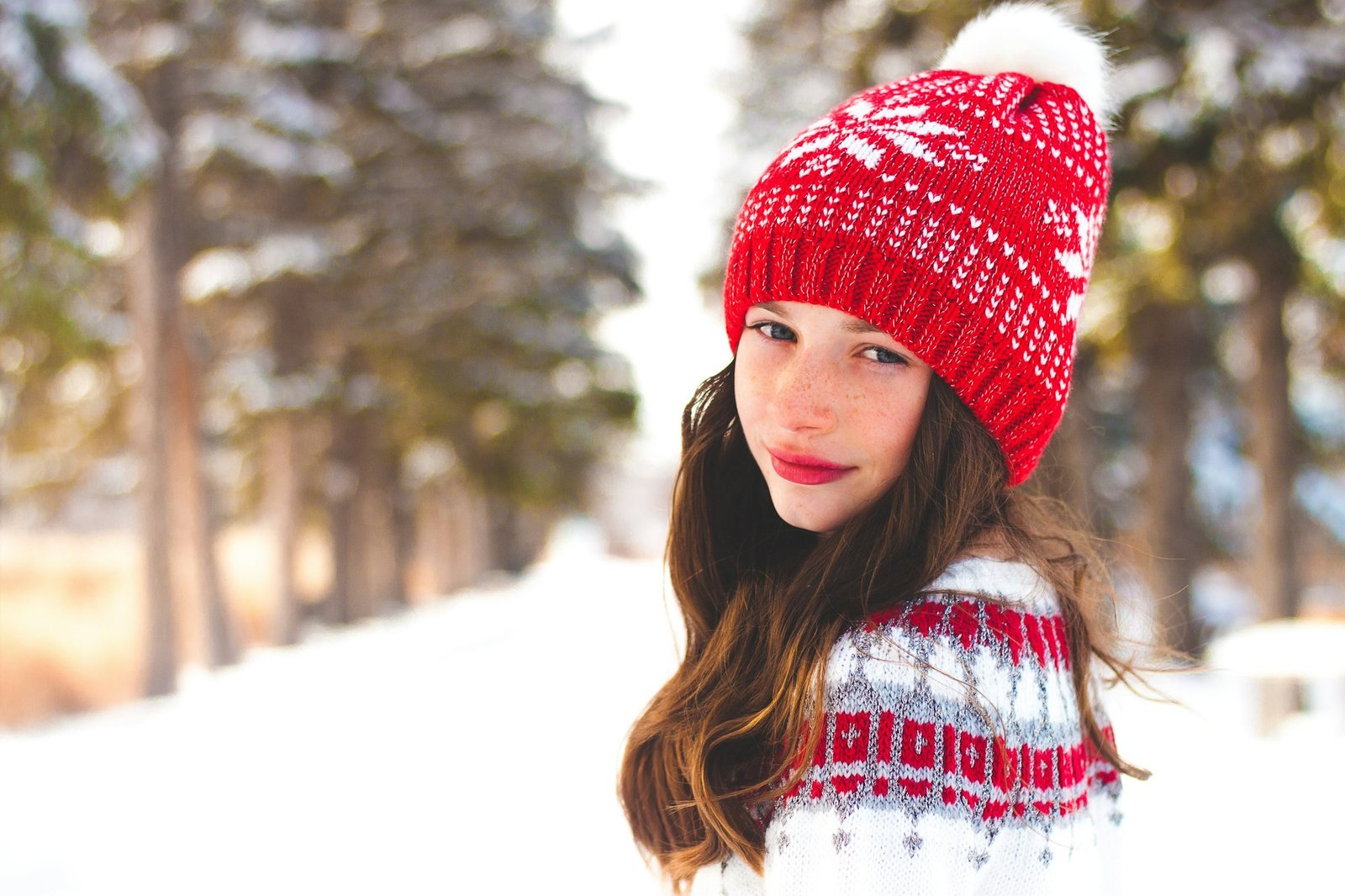 Girl in a winter toque outside aprés ski