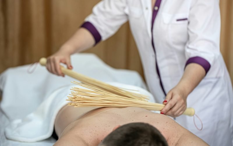 Japanese massage with bamboo brooms, drainage massage.