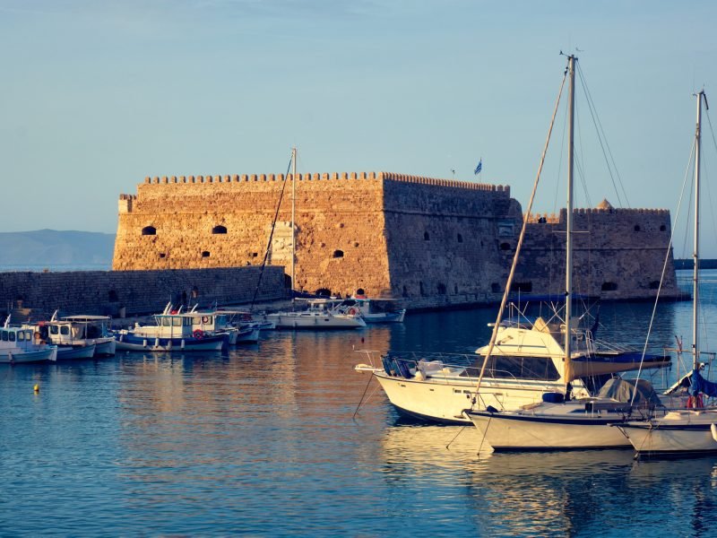 Venetian Fort in Heraklion and moored fishing boats, Crete Island, Greece
